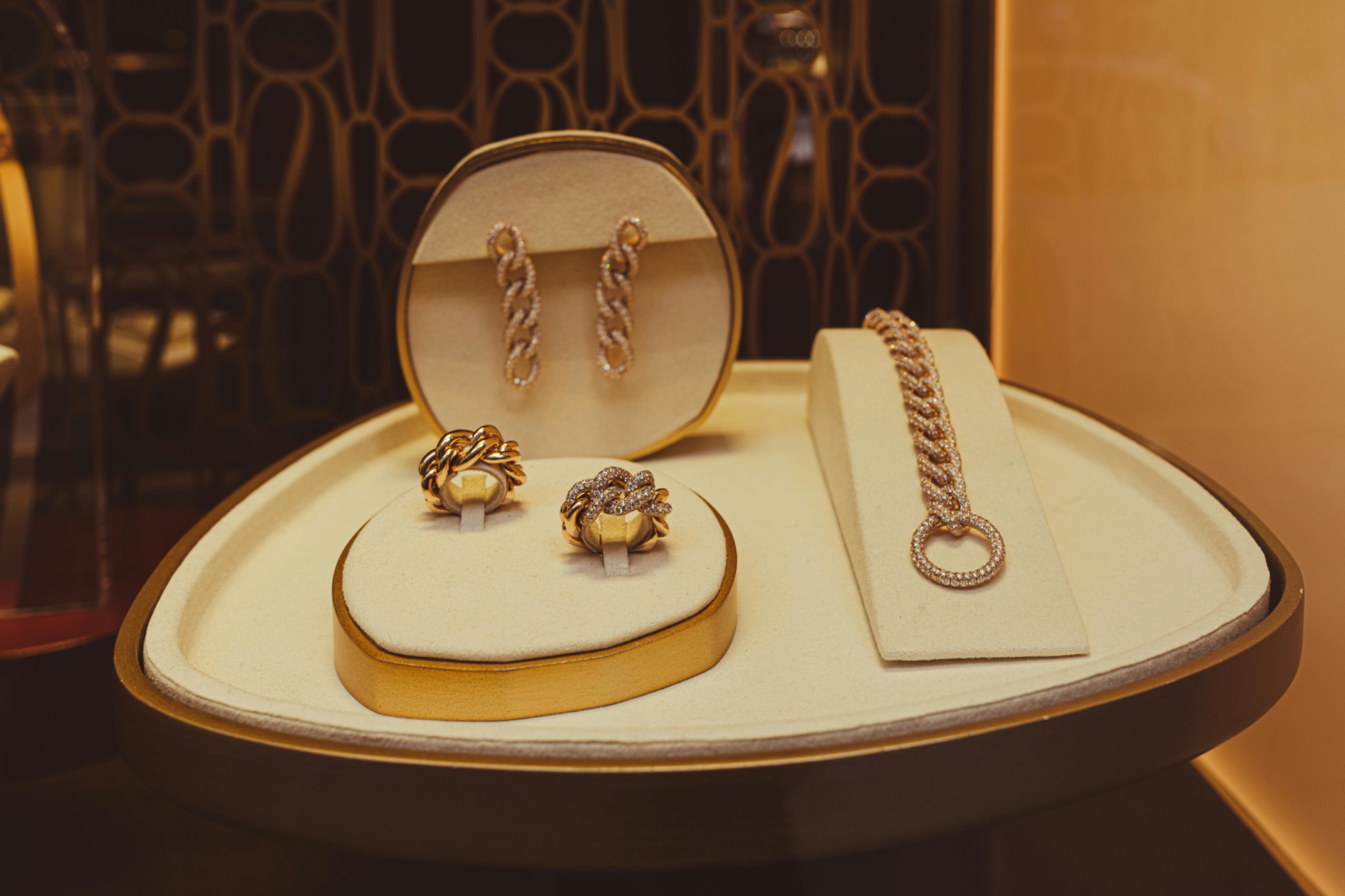 Gold jewelry displayed on a tray